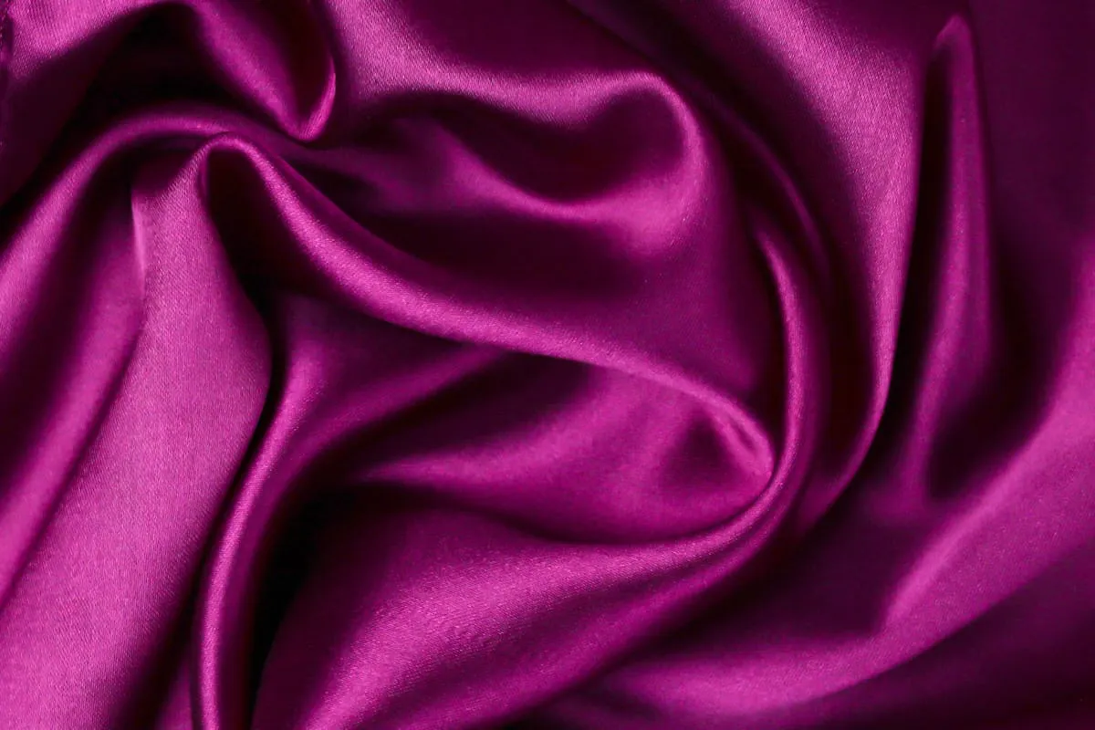 Deep magenta satin with sculpted folds