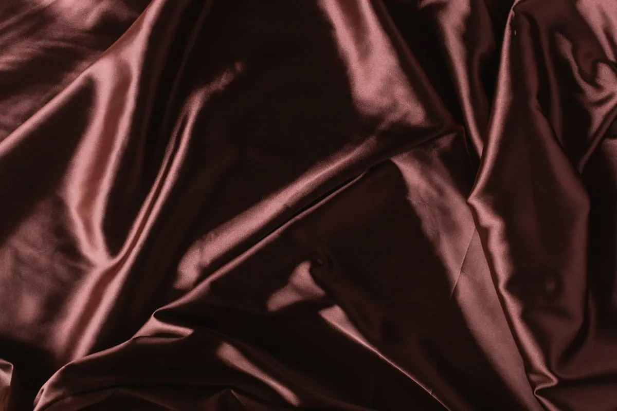 Chocolate brown satin with smooth reflective folds