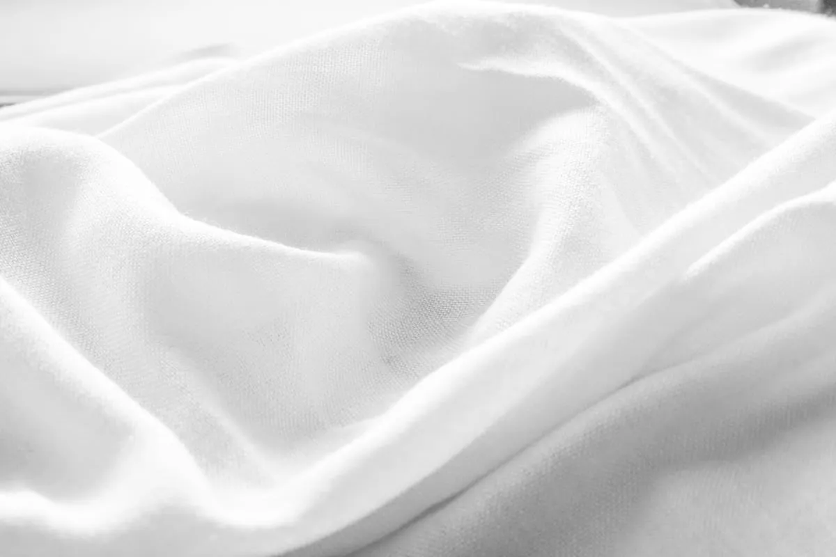 White satin fabric displaying a clean luxury finish