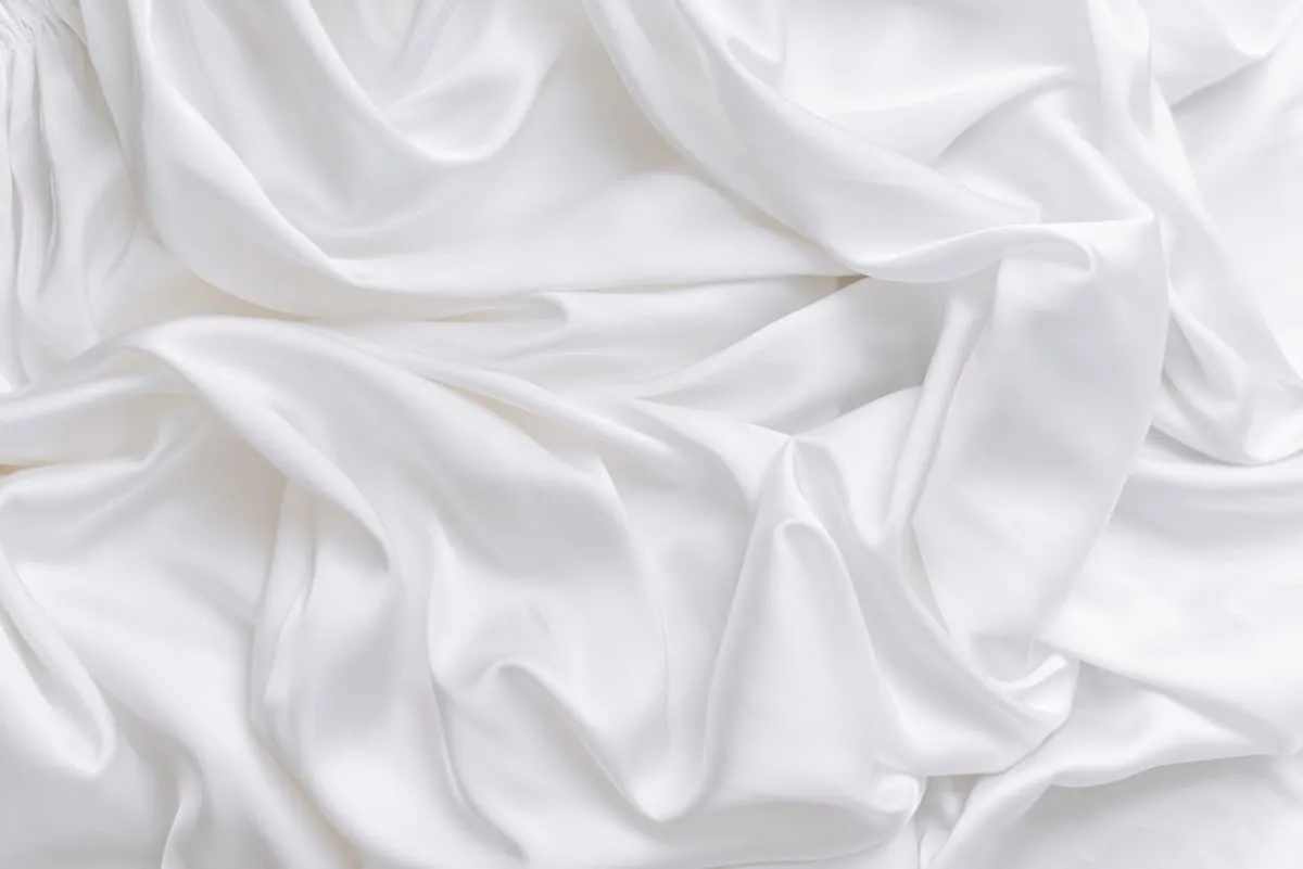 White satin arranged in airy sculptural folds