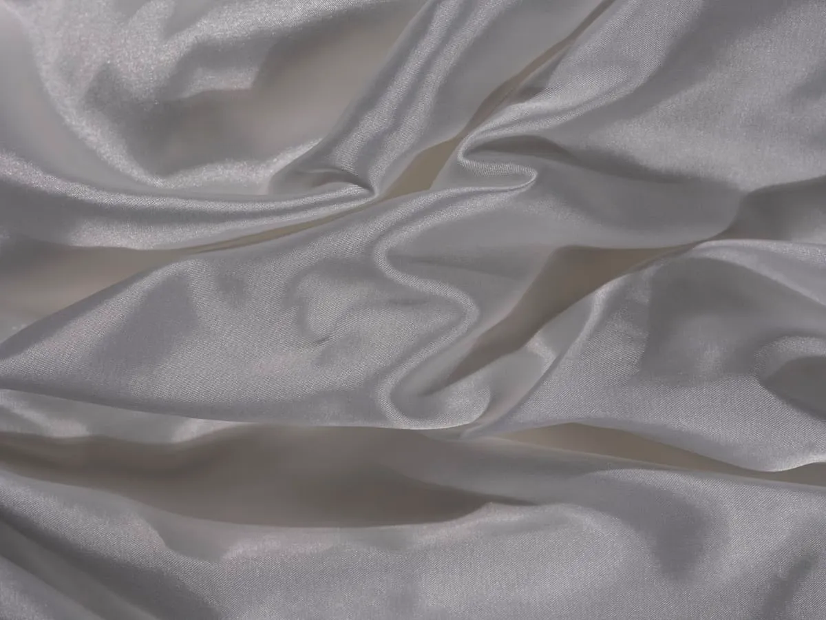 Silver-grey satin with broad fluid folds