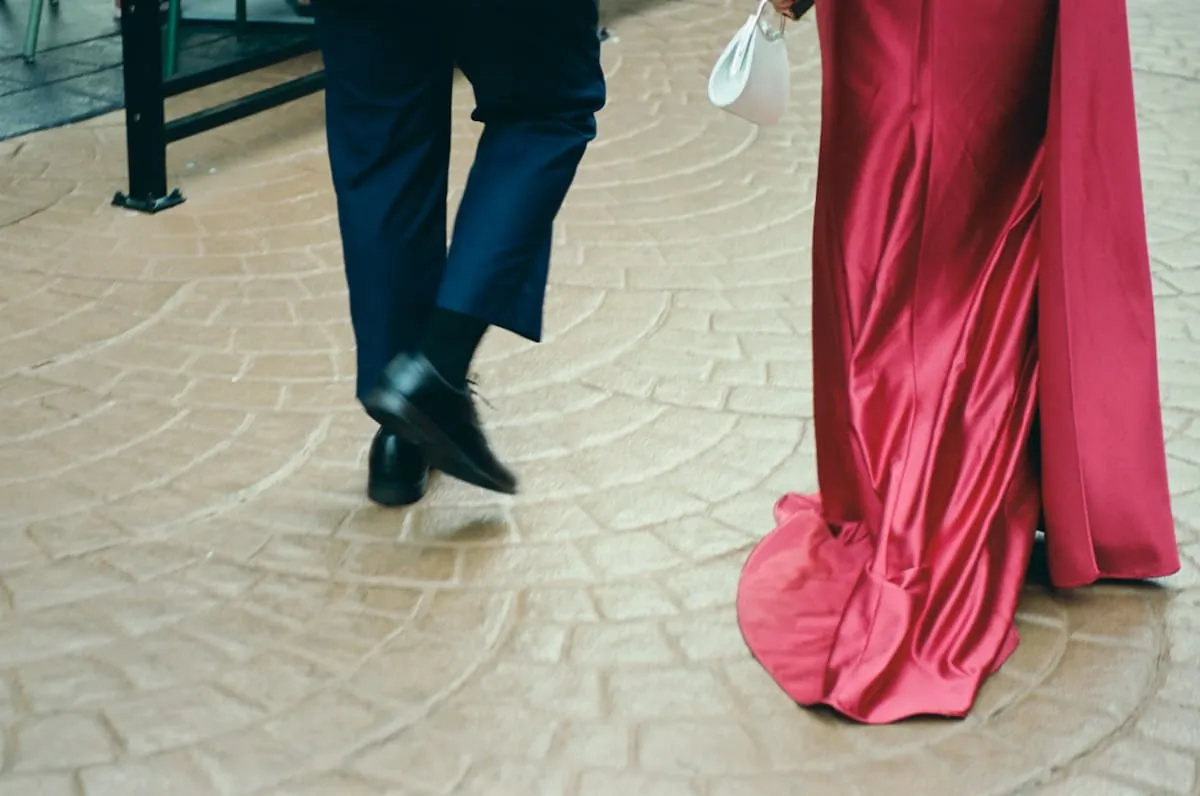 Formal satin gown trailing across an elegant floor